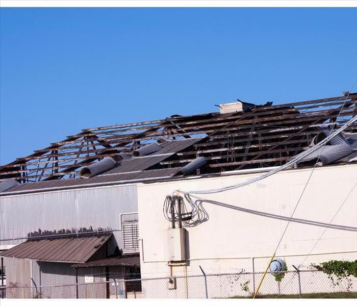 The roof of a commercial building damaged by a fire. 